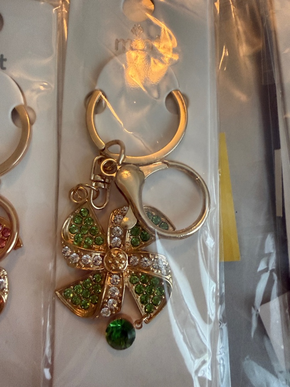 12 Pack Gold-Tone Crystal Keychains. Pinwheel with drop stones.